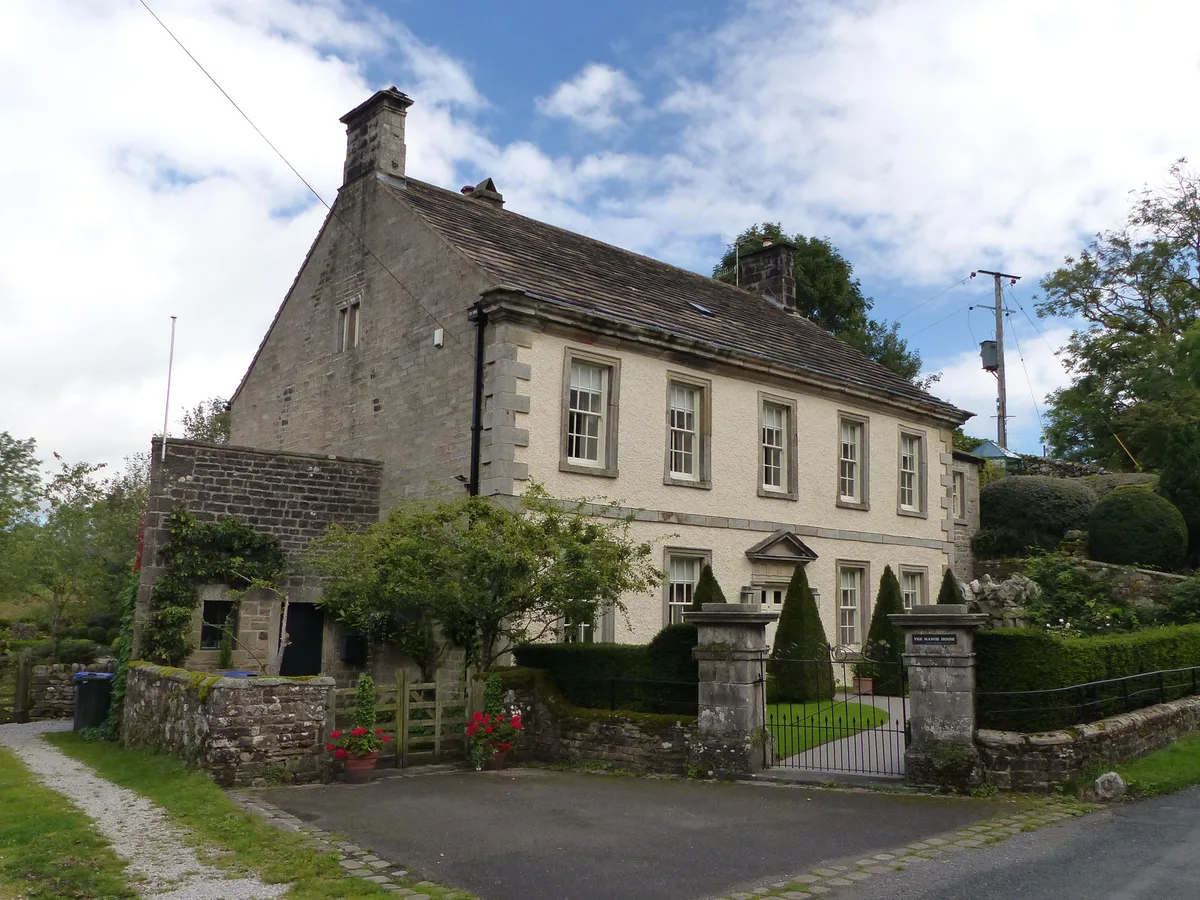 Manor house with wall and gate piers